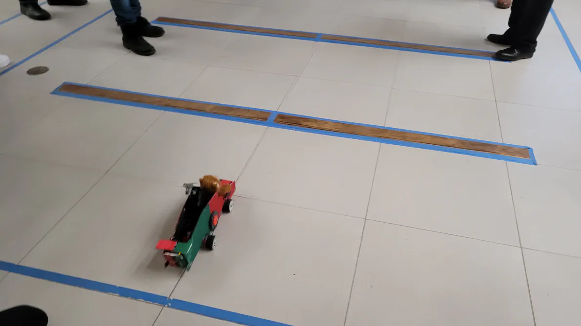 The Teddy Bear Wheelchair in action
              competing in the hurdles section